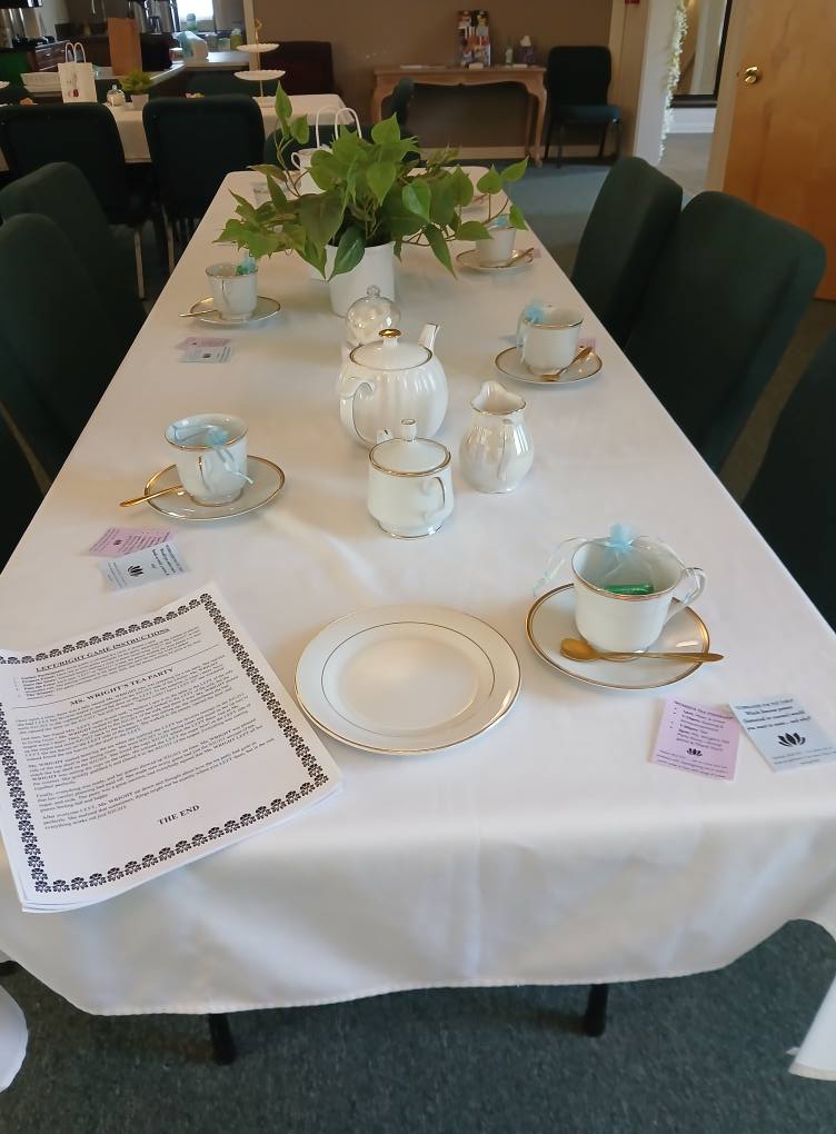 Tea party table setup with tiered serving pieces